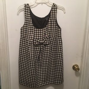 Houndstooth print, wool jumper w/bow front detail.